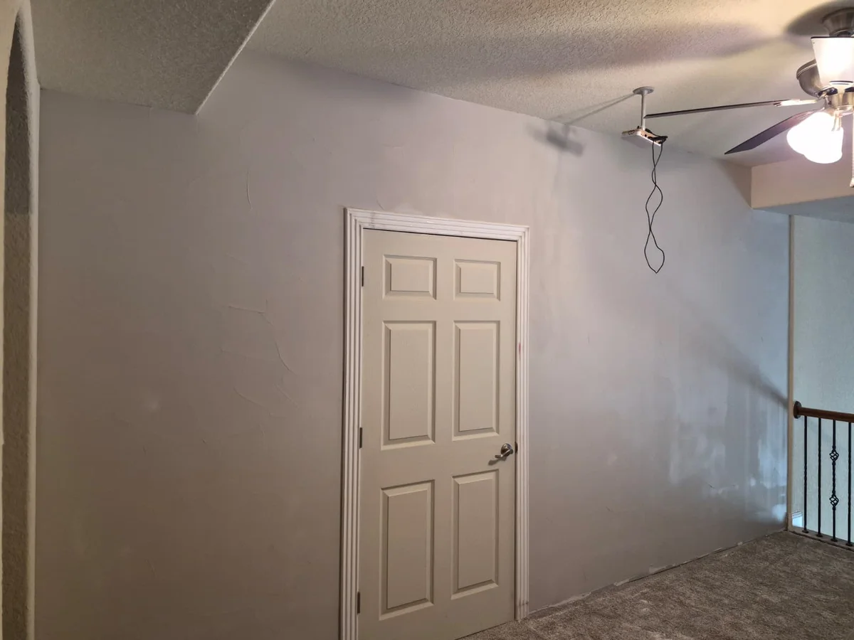 Painted bedroom with door and trim done
